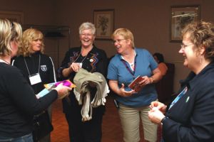 President Vi-Anne Zirnhelt (centre) shares a laugh with Past President Toni Hoyland (far right) and members of CUPE National